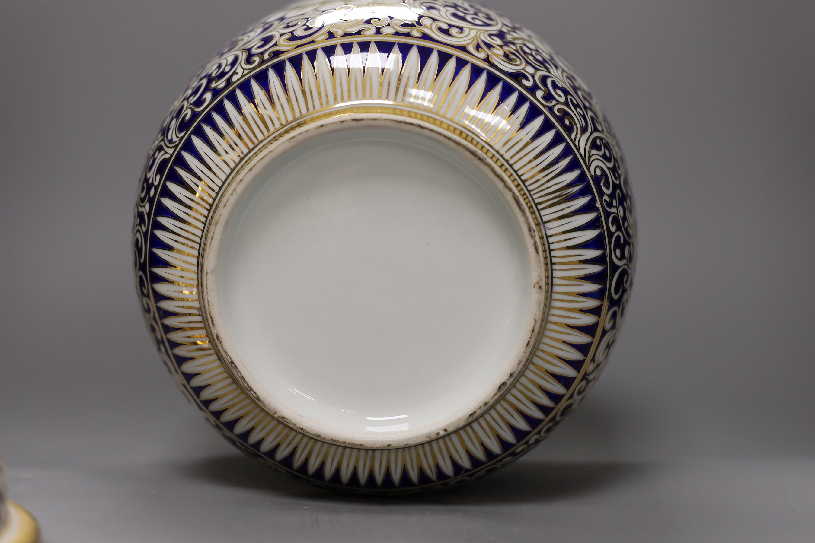 An ornate Continental porcelain bowl and cover, 29cm